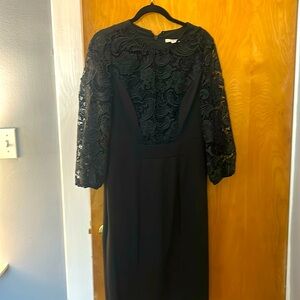 Black dress perfect for a wedding or cocktail event.